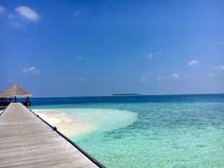 Fototapeta na wymiar Maledives sea water and white beach and bridge