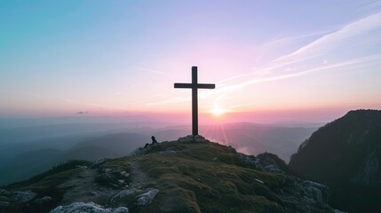 a large cross on the top of the mountain