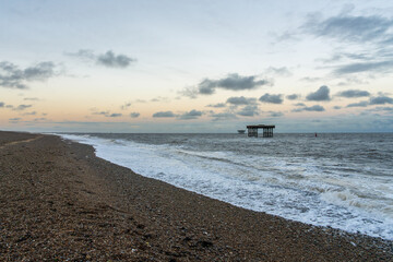 The beach and offshore platforms in Sizewell, Suffolk, England, UK
