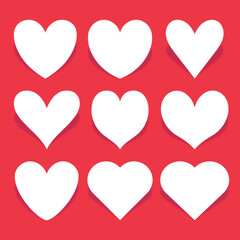 Set of white hearts on red background