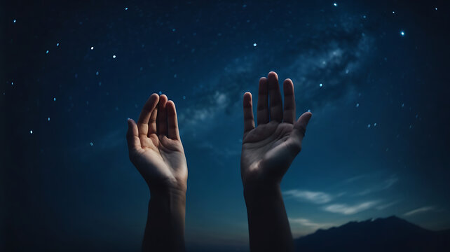 man praying making dua in the beautiful landscape of milkyway star 