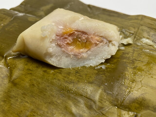 Nagasari or nogosari, traditional pudding with banana slice inside, wrapped in banana leaves. Snack from Indonesia