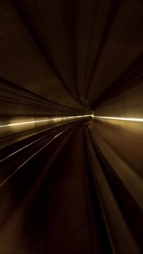 Hyperlapse, POV view of train riding in the subway tunnel, Vertical video. Time lapse of automatic train moving to tunne