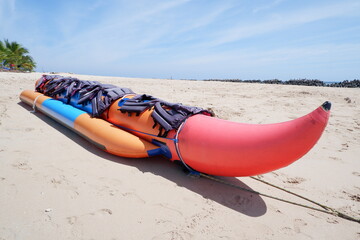 banana boat with life vest safety equipment. holiday entertainment facilities on the beach