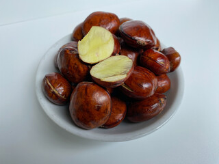 Bean of Archidendron pauciflorum, djenkol, jengkol or blackbead. isolated on white background