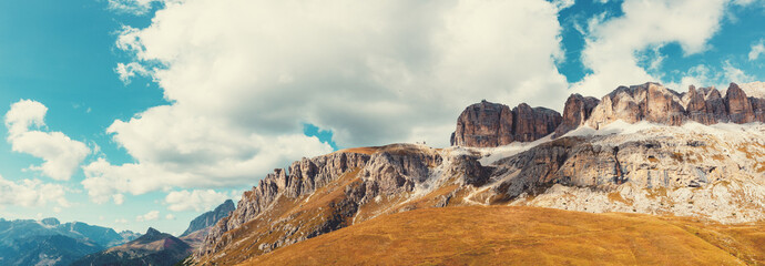 Panoramic view of the mountain landscape in autumn. Piz Boe, Sella Towers. Pordoi Pass in the...