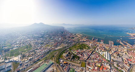 Naples, Italy. Volcano Vesuvius in backlight. Panorama of the city on a summer day. Sunny weather. Aerial view