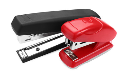 Two new bright staplers isolated on white, closeup
