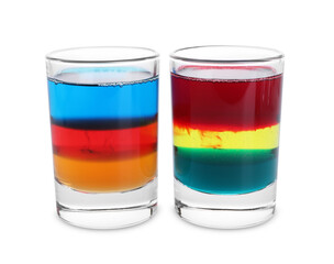 Different shooters in shot glasses isolated on white. Alcohol drink