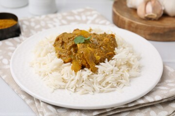 Delicious chicken curry with rice on table, closeup