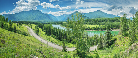 Scenic summer view, river and road in mountain valley, panoramic view
