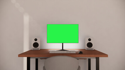Work desk with a green screen computer on it and has speakers on both sides