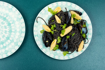 Black pasta with mussels, pasta vongole.