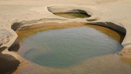 sam phan bok, ubon ratchathani,Rocks have holes that have been eroded by water until they have...