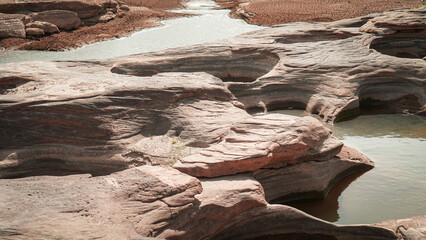 Rocks have holes that have been eroded by water until they have beautiful holes.