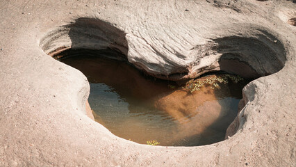 Rocks have holes that have been eroded by water until they have beautiful holes.