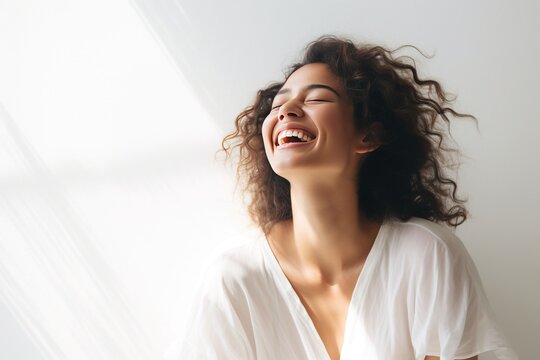 Minimalist yet impactful image capturing the essence of a woman's laughter and positivity, with clean lines and ample white space