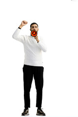 A man, full-length, on a white background, with a megaphone