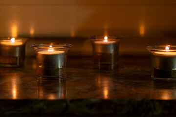 many beautiful burning tealights closeup