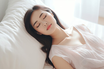 Fototapeta premium Beautiful asian woman sleeping on the bed in the morning