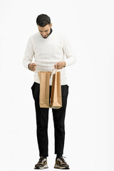 A man, full-length, on a white background, with bags