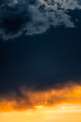 Fototapeta premium Beautiful blue and orange sky with clouds at twilight