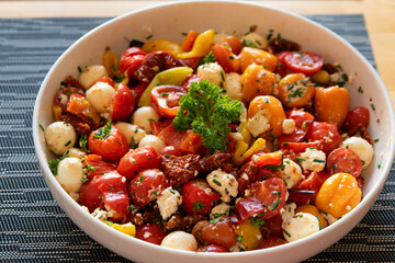 tomato and cheese salad in a bowl