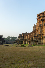 Ancient temple ruins at dusk, showcasing architectural heritage amidst nature.