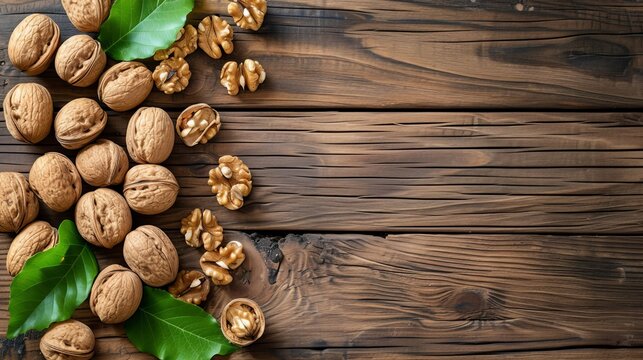 walnuts on wooden background from above   