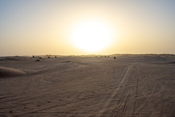 Fototapeta na wymiar Beautiful sunset over Sahara desert in Douz, Tunisia. Sand and dunes against sky