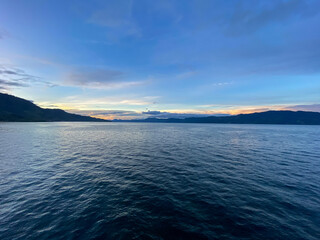 Fototapeta premium Lake Toba view from ferry ship. Ambarita, Samosir - North Sumatra.