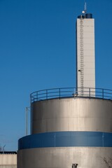 large aluminum metal tank in the sun