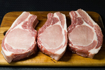 steaks on a wooden board