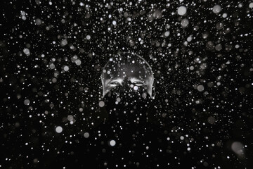 Snowfall on black background. Snowflakes on black background