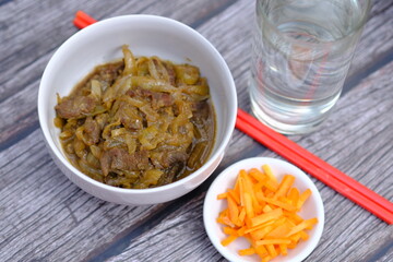 beef teriyaki. Teriyaki is a way of cooking Japanese food that is heated or grilled and coated with soy sauce and flavored sake, mirin, or sugar. Japanese food.