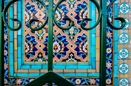 The wall of the mosque with colored mosaics.