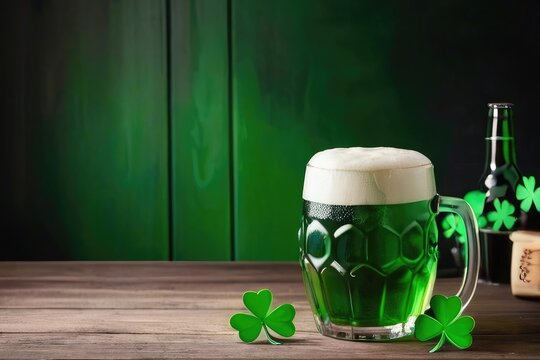 St Patrick's Day - Green Beer with shamrock and abstract green wooden background 