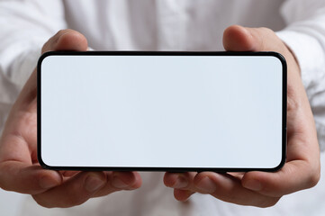 Smartphone with blank screen in two hands