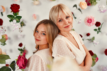 Mom and daughter isolated on background