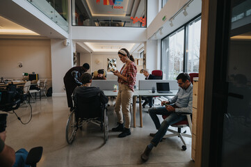 Diverse office environment with team members engaging in various tasks.