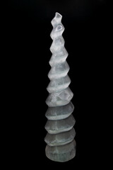 Closeup shot of Raw Tower of Selenite Crystal on black background