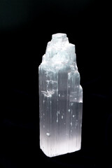 Closeup shot of Raw Tower of Selenite Crystal on black background