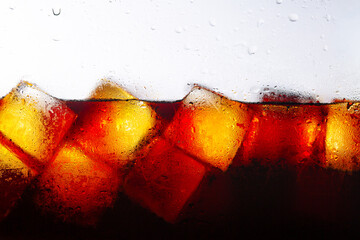 Close-up shot of cola and ice isolated on white background,macro cola texture,Side view background...