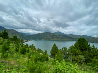 Fototapeta na wymiar Cloudy Sky Against The Lake. Lake Toba taken from Sibea-bea hills, North Sumatra.