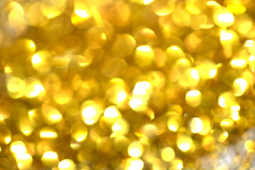 Sparkling Glitter on White Background Bokeh Abstract Close Up Gold