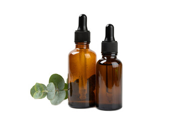 Obraz na płótnie Canvas Eucalyptus essential oil in a glass bottle with green eucalyptus leaves isolated on white background. Aromatherapy. Spa. Concept of natural cosmetology and beauty industry.