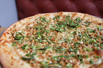Elote pizza on a plate on the table at a restaurant in Columbus, Ohio	