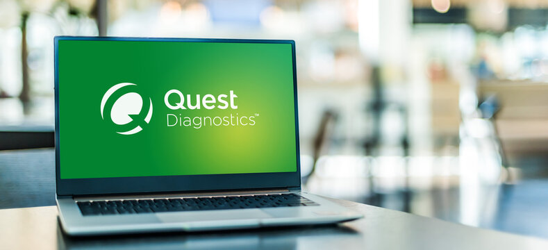 Laptop computer displaying logo of Quest Diagnostics