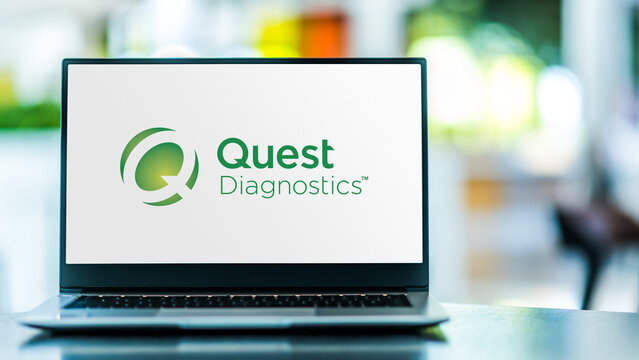 Laptop computer displaying logo of Quest Diagnostics
