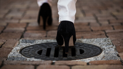 Narrowly missed the manhole cover with high heels (b/w)